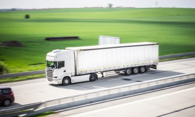 A truck that is driving down the road Description automatically generated