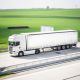 A truck that is driving down the road Description automatically generated